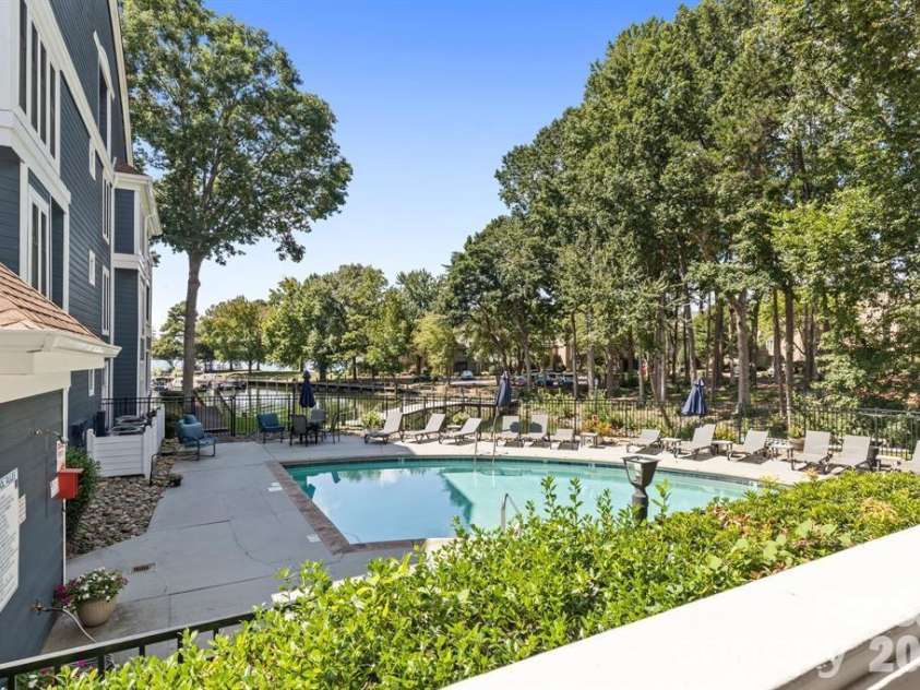 719 Southwest Drive, Davidson, NC 28036.  MLS# CAR4373406, YatesRealty ID 28209. Pool outside back patio