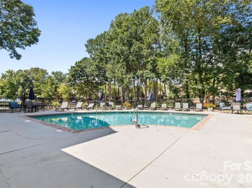 719 Southwest Drive, Davidson, NC 28036.  MLS# CAR4373406, YatesRealty ID 28209. Pool outside patio