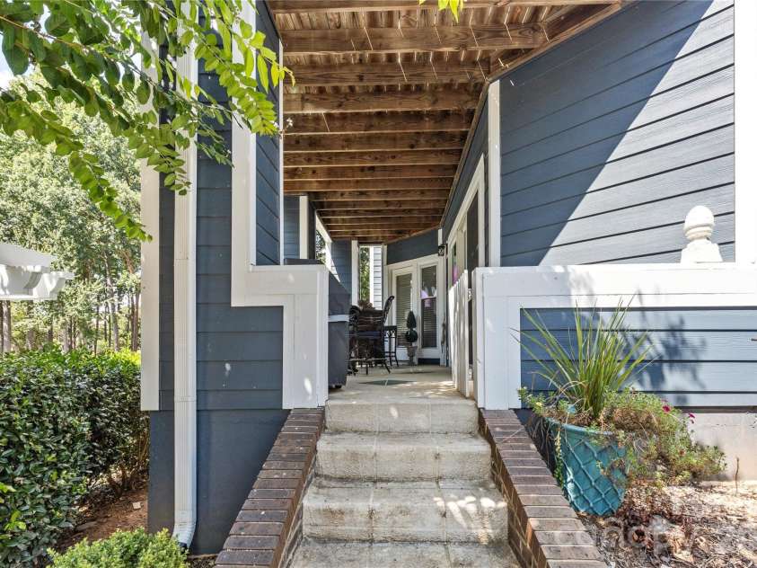 719 Southwest Drive, Davidson, NC 28036.  MLS# CAR4373406, YatesRealty ID 28209. Private patio entry