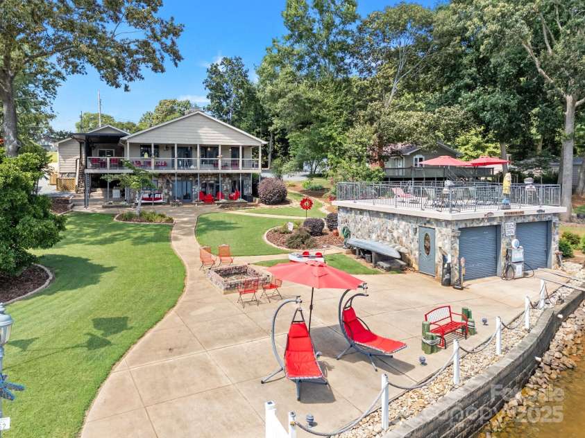 643 Lake Drive, Lexington, NC 27292.  MLS# CAR4277552, YatesRealty ID 28214. Boat house has an outdoor shower!