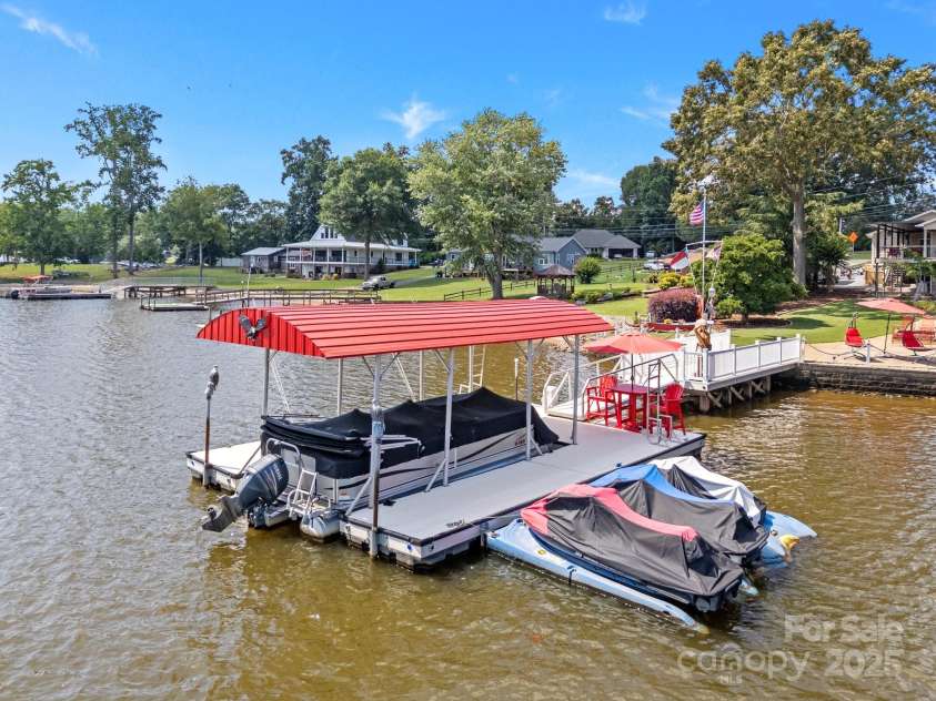 643 Lake Drive, Lexington, NC 27292.  MLS# CAR4277552, YatesRealty ID 28214. U shaped private dock features 3 jet ski ramps and fold up dock ladders & floater