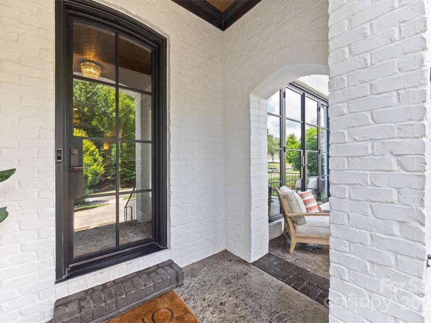 1223 Home Place, Matthews, NC 28105.  MLS# CAR4265332, YatesRealty ID 28217. Covered entryway with stately front door