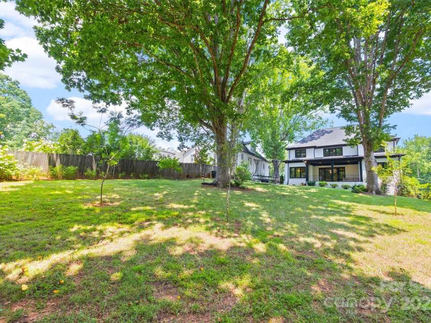 1223 Home Place, Matthews, NC 28105.  MLS# CAR4265332, YatesRealty ID 28217. Fully fenced 0.54 acre lot with mature trees and no HOA!