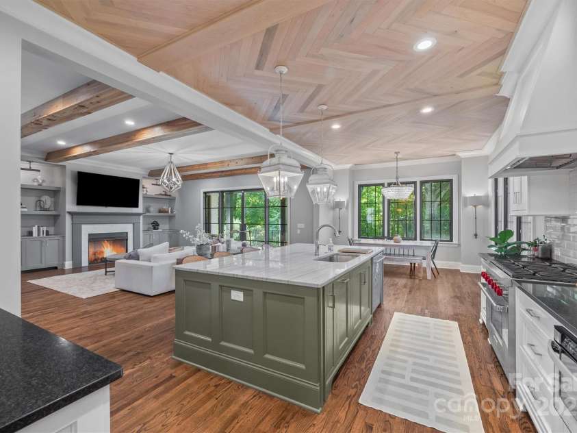1223 Home Place, Matthews, NC 28105.  MLS# CAR4265332, YatesRealty ID 28217. Luxurious Kitchen features oversized island, high-end appliances, a walk-in pantry, & more