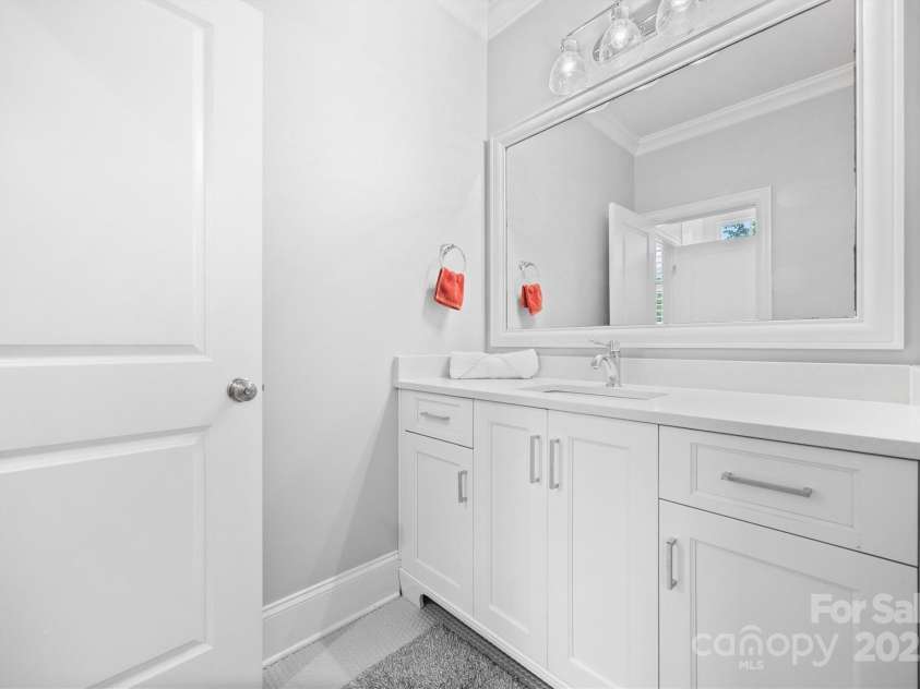 1223 Home Place, Matthews, NC 28105.  MLS# CAR4265332, YatesRealty ID 28217. Upstairs Bathroom 2 is a jack and jill setup with separate vanities for each attached bedroom, and a shared shower for 2 of the bedrooms.