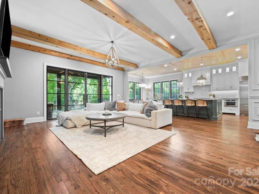 1223 Home Place, Matthews, NC 28105.  MLS# CAR4265332, YatesRealty ID 28217. Wood beams add cozy warmth & room separation to an already stunning space.