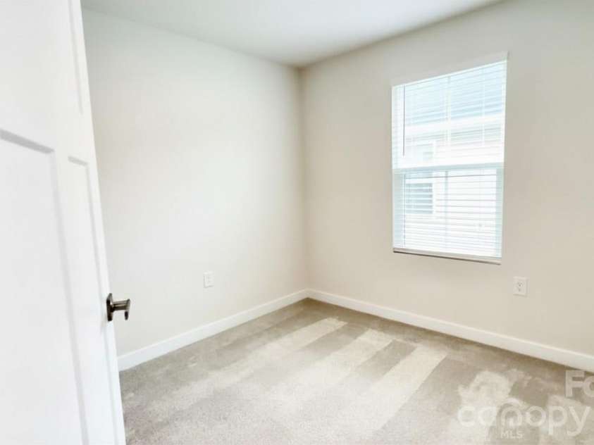5513 Hughesdale Drive, Charlotte, NC 28215.  MLS# CAR4383435, YatesRealty ID 28219. Secondary bedroom