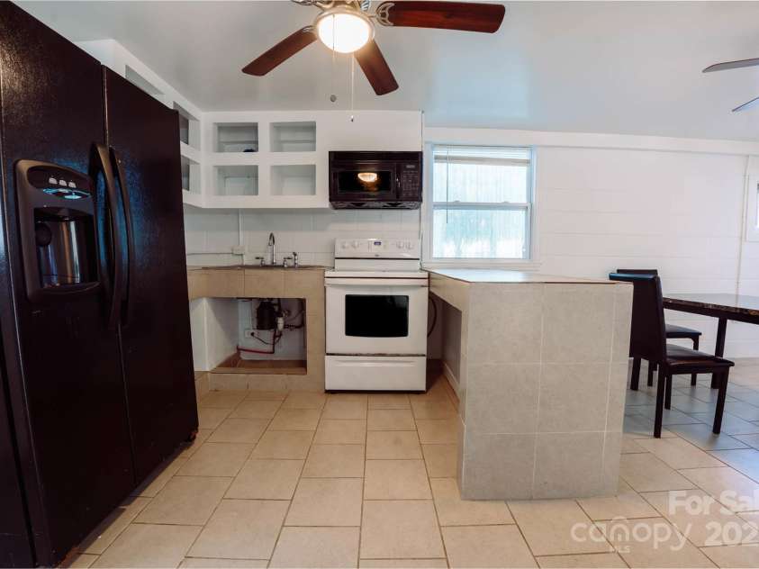 152 Woodlynn Drive, Charlotte, NC 28214.  MLS# CAR4207803, YatesRealty ID 2822. Basement kitchen 1