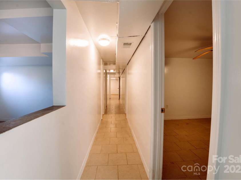 152 Woodlynn Drive, Charlotte, NC 28214.  MLS# CAR4207803, YatesRealty ID 2822. Hall basement