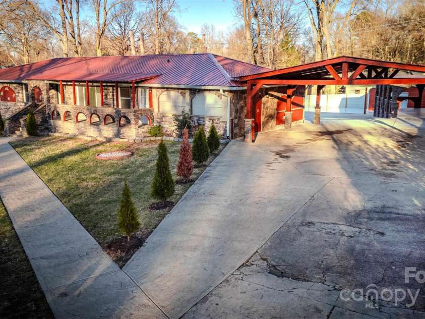 152 Woodlynn Drive, Charlotte, NC 28214.  MLS# CAR4207803, YatesRealty ID 2822. Long driveway for ample parking in addition to carport