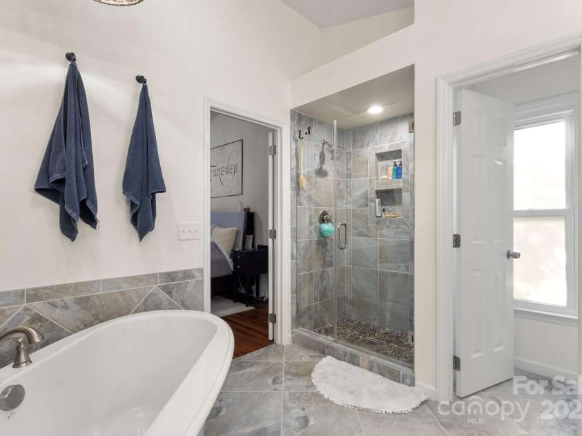 12602 Angel Oak Drive, Huntersville, NC 28078.  MLS# CAR4259942, YatesRealty ID 28225. Primary tiled shower has plenty of room and enjoy your large soaker tub!