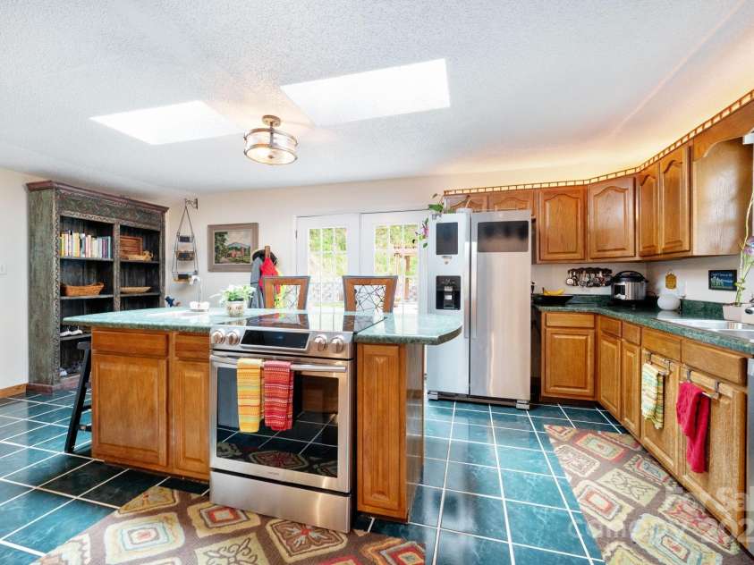 98 Mashburn Branch Road, Old Fort, NC 28762.  MLS# CAR4266767, YatesRealty ID 28229. Breakfast bar and ample storage