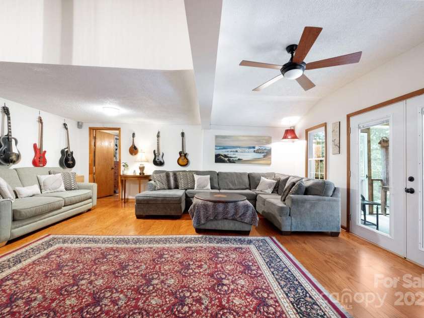 98 Mashburn Branch Road, Old Fort, NC 28762.  MLS# CAR4266767, YatesRealty ID 28229. Huge family room for gathering and entertaining