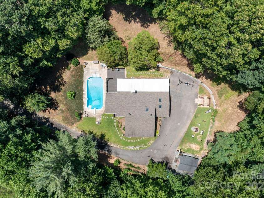 98 Mashburn Branch Road, Old Fort, NC 28762.  MLS# CAR4266767, YatesRealty ID 28229. Large 0.77 acres yard is private and convenient