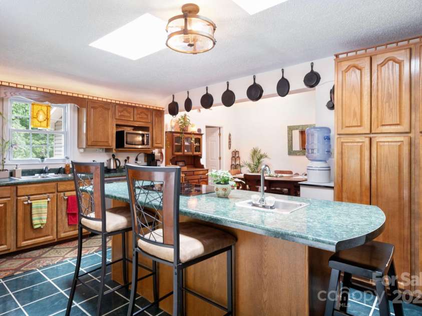 98 Mashburn Branch Road, Old Fort, NC 28762.  MLS# CAR4266767, YatesRealty ID 28229. Large island in kitchen with breakfast bar