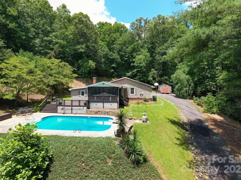 98 Mashburn Branch Road, Old Fort, NC 28762.  MLS# CAR4266767, YatesRealty ID 28229. Property boast an in-ground swimming pool and screened in porch
