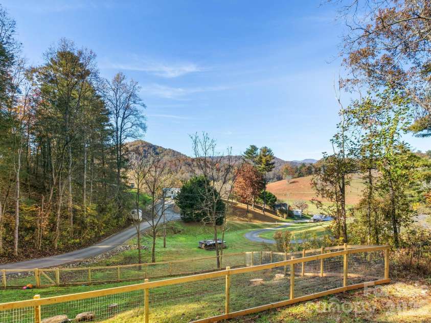 30 Shire Way Lane, Leicester, NC 28748.  MLS# CAR4319147, YatesRealty ID 2823. Fenced yard + road leading to home + Views 