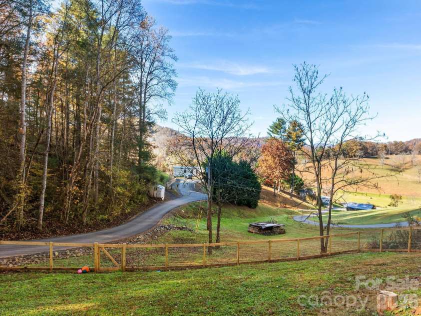 30 Shire Way Lane, Leicester, NC 28748.  MLS# CAR4319147, YatesRealty ID 2823. Fenced yard + road leading to home + Views