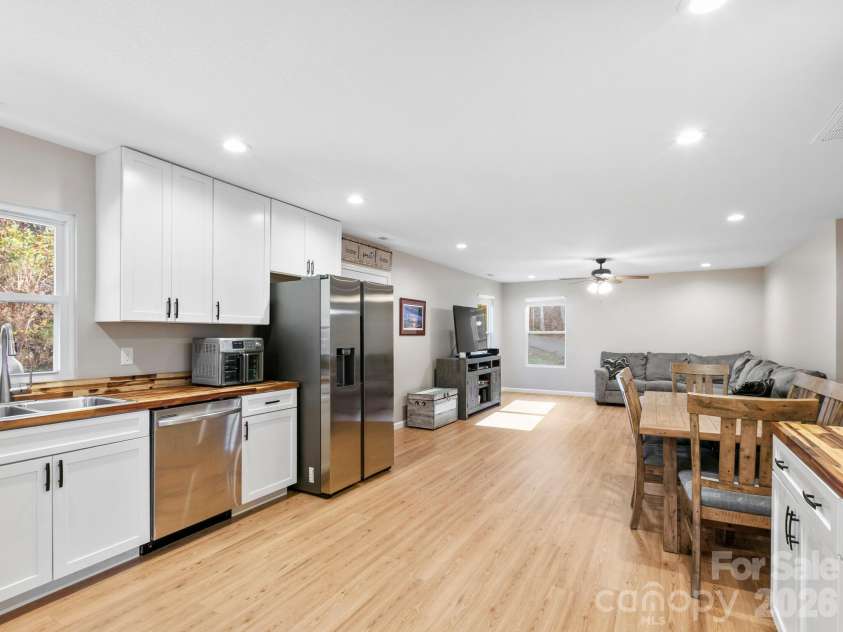 30 Shire Way Lane, Leicester, NC 28748.  MLS# CAR4319147, YatesRealty ID 2823. Kitchen + Dining Area + Living Room 