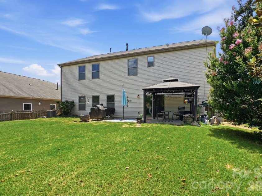 1231 Tranquil Falls Lane, Matthews, NC 28104.  MLS# CAR4390009, YatesRealty ID 28232. Fenced in Backyard