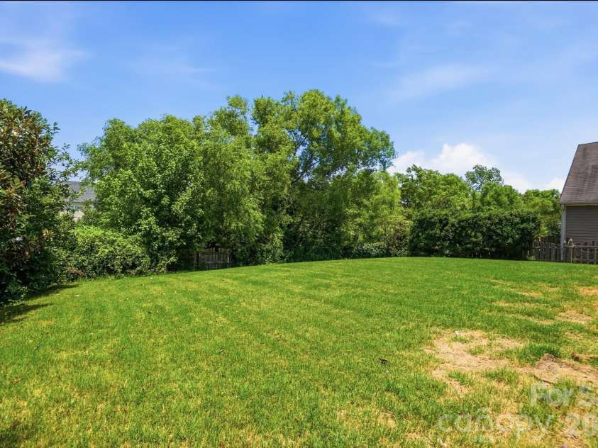 1231 Tranquil Falls Lane, Matthews, NC 28104.  MLS# CAR4390009, YatesRealty ID 28232. Fenced in Backyard