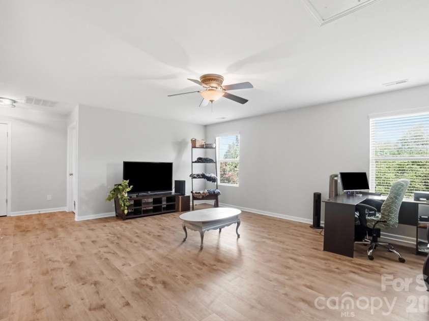 1231 Tranquil Falls Lane, Matthews, NC 28104.  MLS# CAR4390009, YatesRealty ID 28232. Large Bonus/Loft Area