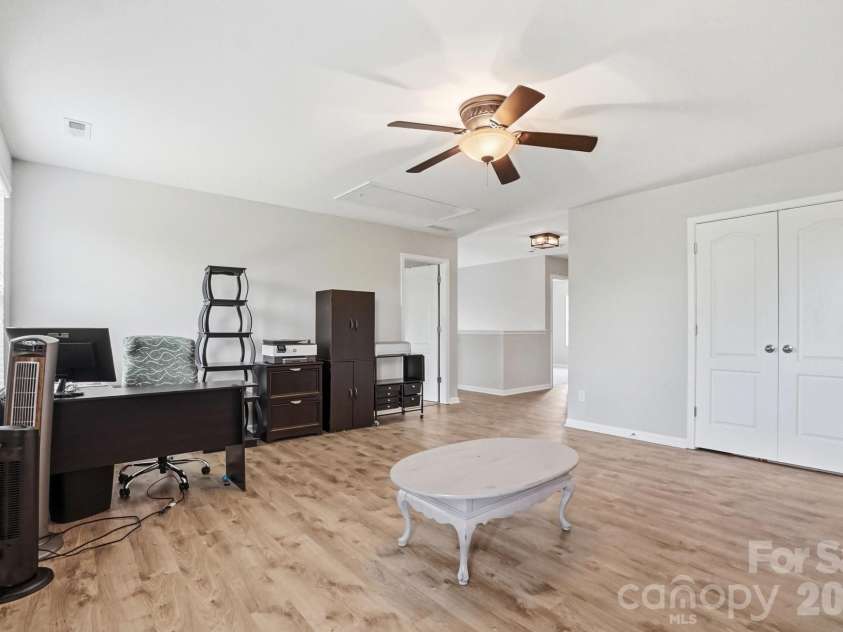 1231 Tranquil Falls Lane, Matthews, NC 28104.  MLS# CAR4390009, YatesRealty ID 28232. Large Bonus/Loft Area