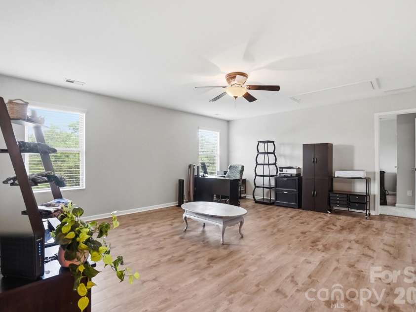 1231 Tranquil Falls Lane, Matthews, NC 28104.  MLS# CAR4390009, YatesRealty ID 28232. Large Bonus/Loft Area