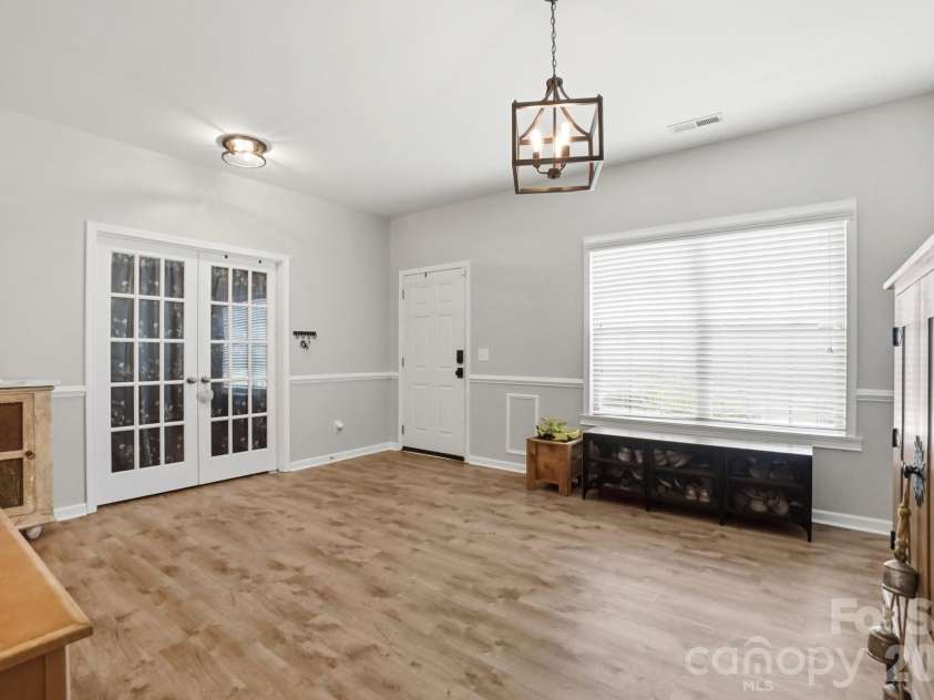 1231 Tranquil Falls Lane, Matthews, NC 28104.  MLS# CAR4390009, YatesRealty ID 28232. Living Room