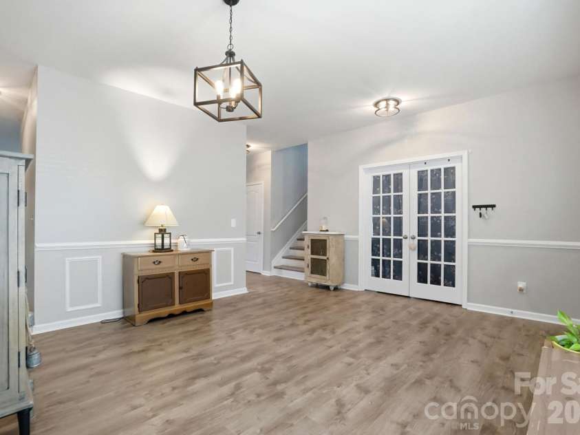 1231 Tranquil Falls Lane, Matthews, NC 28104.  MLS# CAR4390009, YatesRealty ID 28232. Living/Dining Room