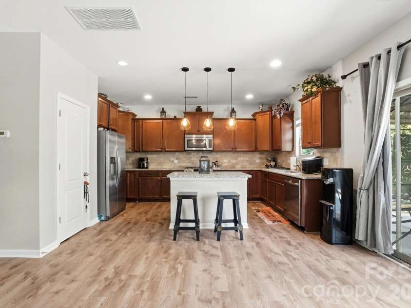 1231 Tranquil Falls Lane, Matthews, NC 28104.  MLS# CAR4390009, YatesRealty ID 28232. Open Floorplan to Kitchen