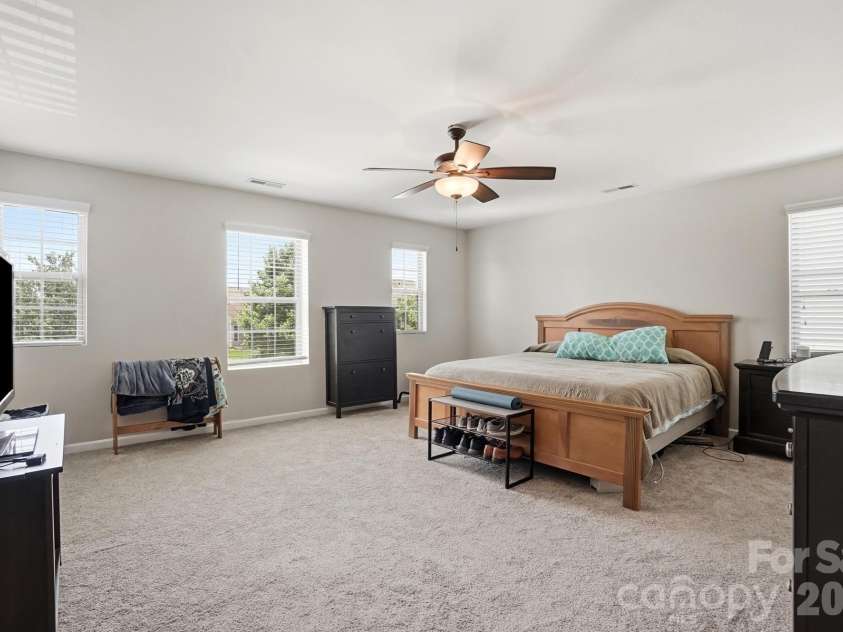 1231 Tranquil Falls Lane, Matthews, NC 28104.  MLS# CAR4390009, YatesRealty ID 28232. Primary Suite