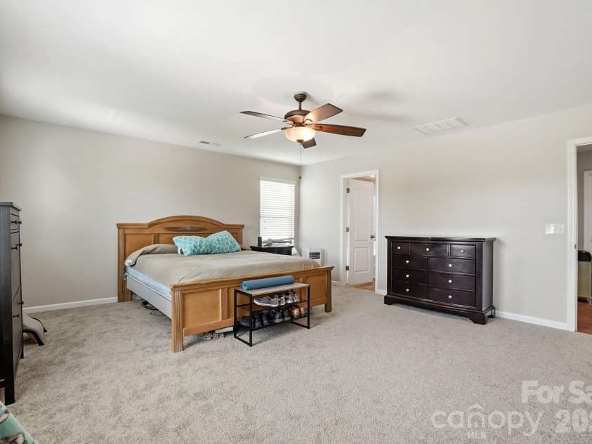 1231 Tranquil Falls Lane, Matthews, NC 28104.  MLS# CAR4390009, YatesRealty ID 28232. Primary Suite