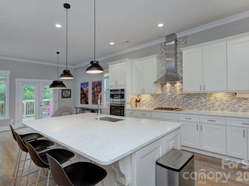 2109 Lanier Avenue, Charlotte, NC 28205.  MLS# CAR4389130, YatesRealty ID 28233. Tile backsplash and Quartz countertops