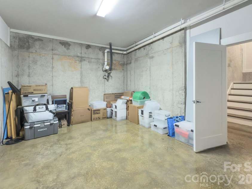 2109 Lanier Avenue, Charlotte, NC 28205.  MLS# CAR4389130, YatesRealty ID 28233. Unheated flex space in basement currently used as storage