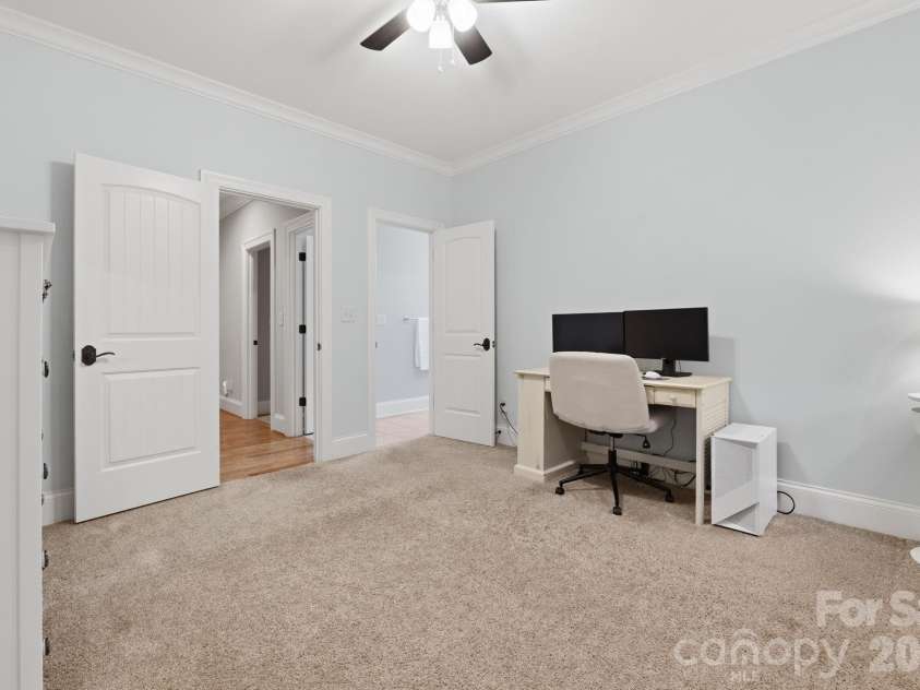 184 Ashmore Circle, Troutman, NC 28166.  MLS# CAR4384807, YatesRealty ID 28237. Bright secondary bedroom with easy access to adjacent bath and upper-level living areas.