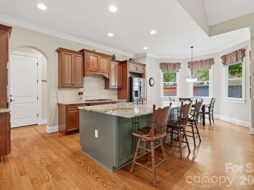 184 Ashmore Circle, Troutman, NC 28166.  MLS# CAR4384807, YatesRealty ID 28237. Designed for entertaining with abundant workspace, seating, and a sunny breakfast nook.