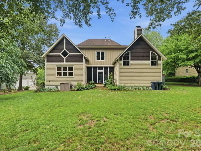 184 Ashmore Circle, Troutman, NC 28166.  MLS# CAR4384807, YatesRealty ID 28237. Expansive backyard backing to a wooded buffer, offering privacy, space to play, and room to relax.
