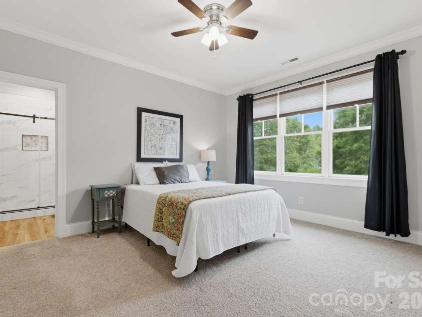 184 Ashmore Circle, Troutman, NC 28166.  MLS# CAR4384807, YatesRealty ID 28237. Generously sized secondary bedroom with large window and ensuite bath access.