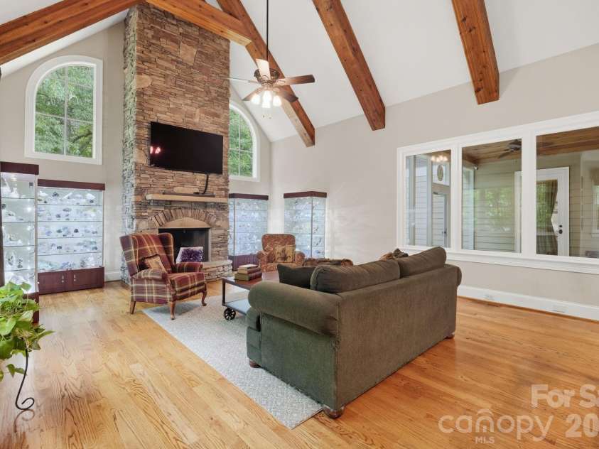 184 Ashmore Circle, Troutman, NC 28166.  MLS# CAR4384807, YatesRealty ID 28237. Open and inviting gathering space with soaring ceilings and seamless access to the sunroom.