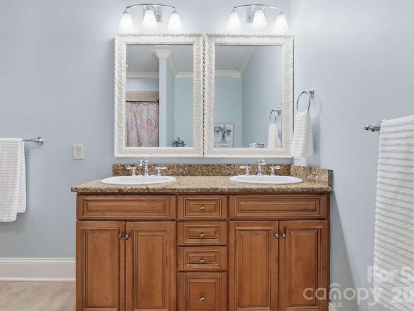 184 Ashmore Circle, Troutman, NC 28166.  MLS# CAR4384807, YatesRealty ID 28237. Spacious dual-sink vanity offering ample storage and functionality.
