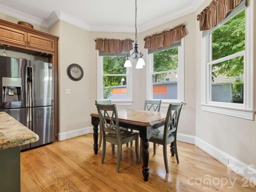 184 Ashmore Circle, Troutman, NC 28166.  MLS# CAR4384807, YatesRealty ID 28237. Sunlit breakfast area surrounded by windows overlooking the beautifully landscaped grounds.