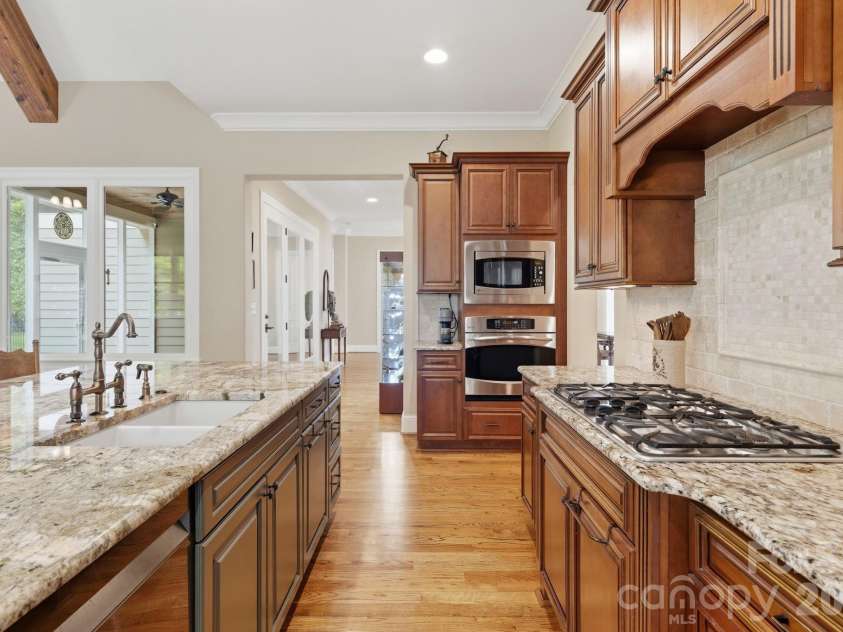 184 Ashmore Circle, Troutman, NC 28166.  MLS# CAR4384807, YatesRealty ID 28237. Thoughtfully designed kitchen offering extensive counter space and built-in appliances.