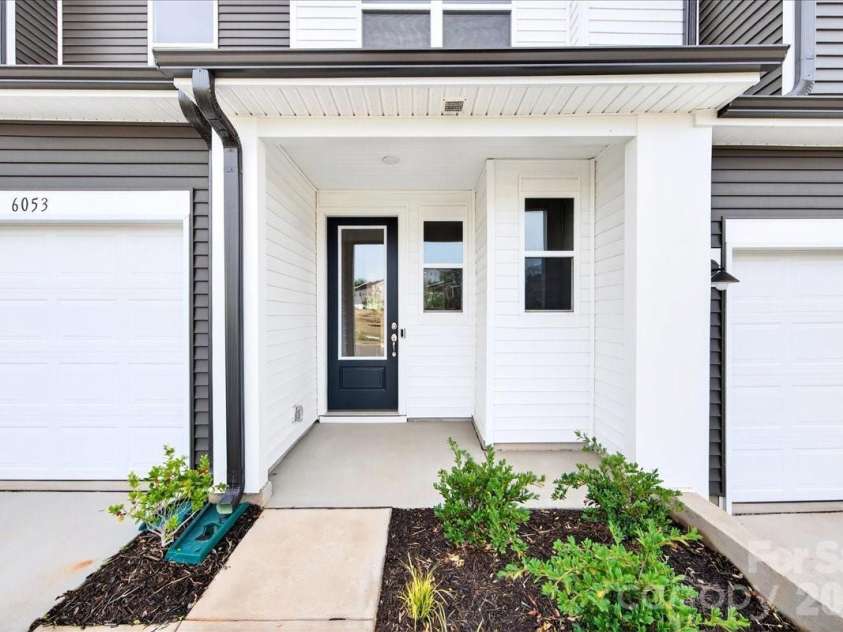 6053 Longar Lane, Charlotte, NC 28269.  MLS# CAR4368932, YatesRealty ID 28239. Covered front porch 