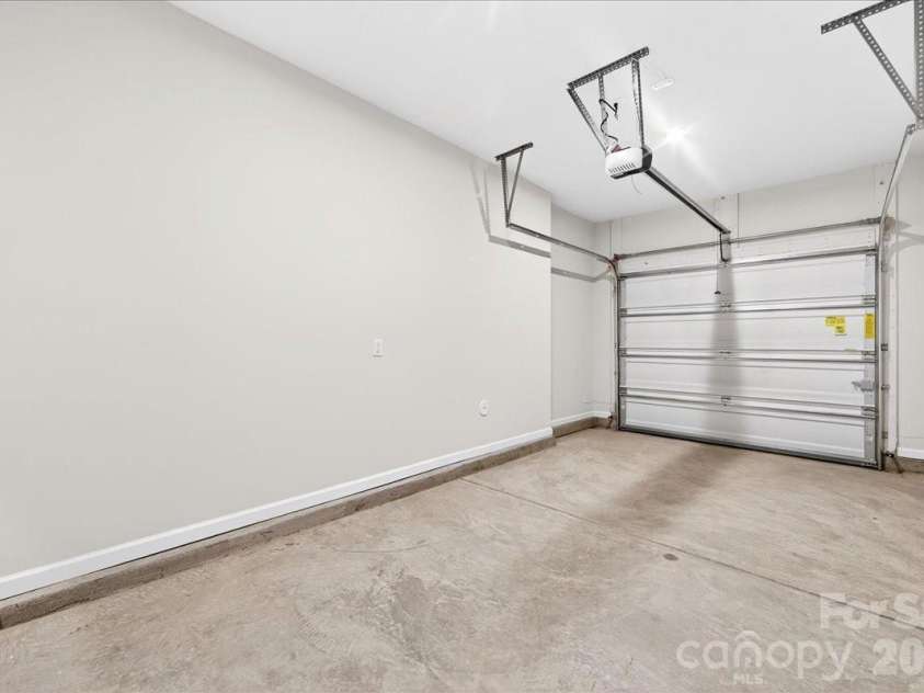 6053 Longar Lane, Charlotte, NC 28269.  MLS# CAR4368932, YatesRealty ID 28239. Garage 
