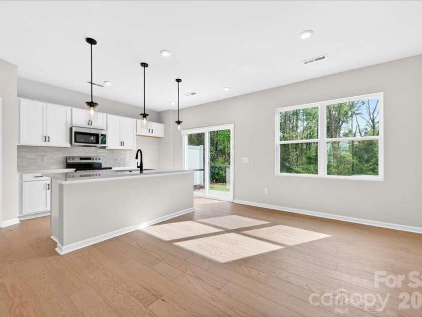 6053 Longar Lane, Charlotte, NC 28269.  MLS# CAR4368932, YatesRealty ID 28239. Light filled dining space 