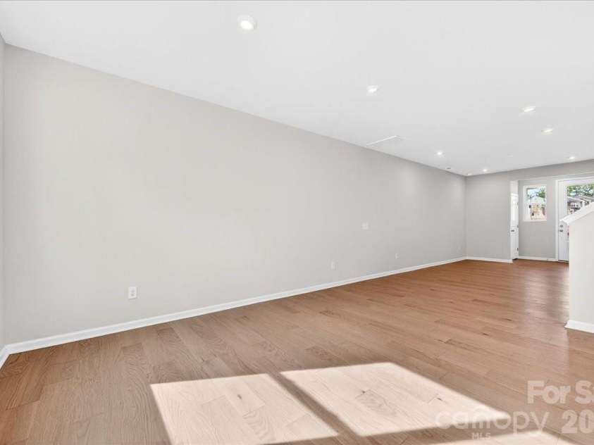 6053 Longar Lane, Charlotte, NC 28269.  MLS# CAR4368932, YatesRealty ID 28239. Light filled first floor