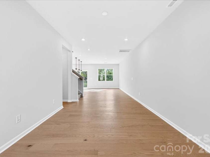 6053 Longar Lane, Charlotte, NC 28269.  MLS# CAR4368932, YatesRealty ID 28239. Open concept living