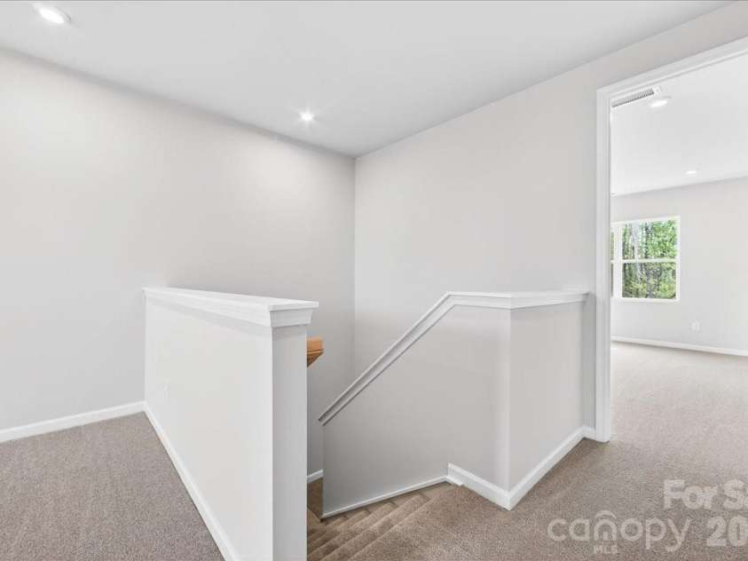 6053 Longar Lane, Charlotte, NC 28269.  MLS# CAR4368932, YatesRealty ID 28239. Second floor landing 