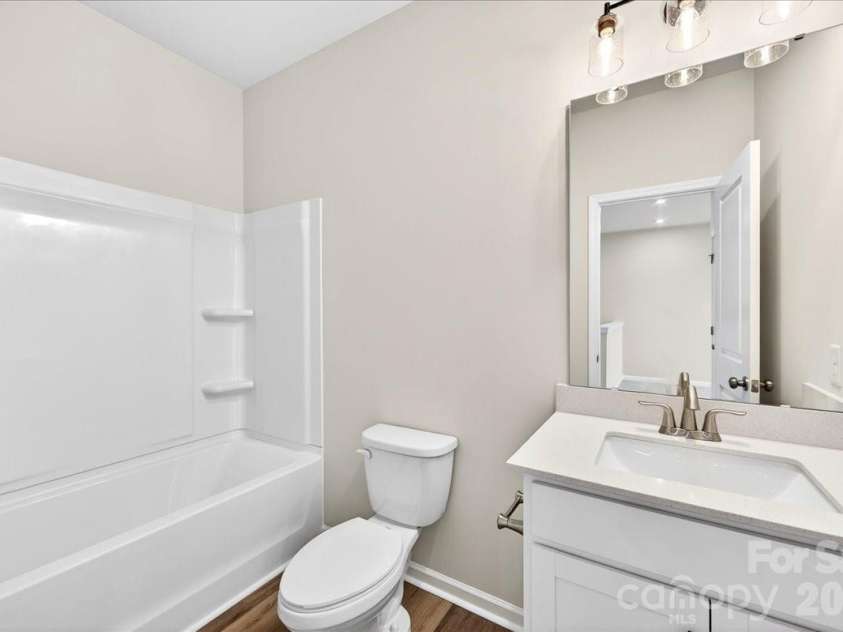 6053 Longar Lane, Charlotte, NC 28269.  MLS# CAR4368932, YatesRealty ID 28239. Secondary bathroom